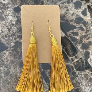 Yellow tassel earrings.
